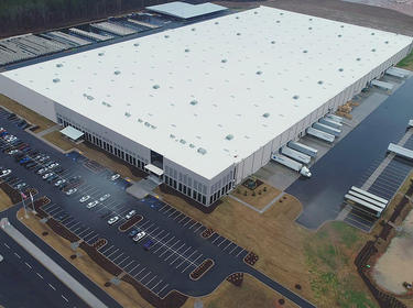 Aerial photo of a warehouse and surrounding parkinglot and truck courts