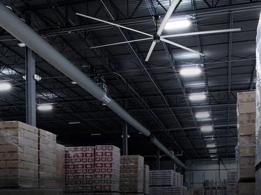 Large fan on the ceiling of a warehouse