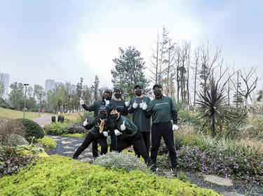 Six team members work outside during IMPACT Day 2021