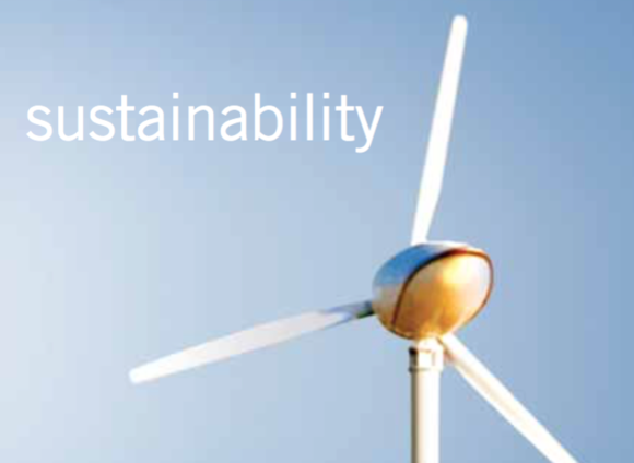 A photo of a windmill with the word "sustainability"