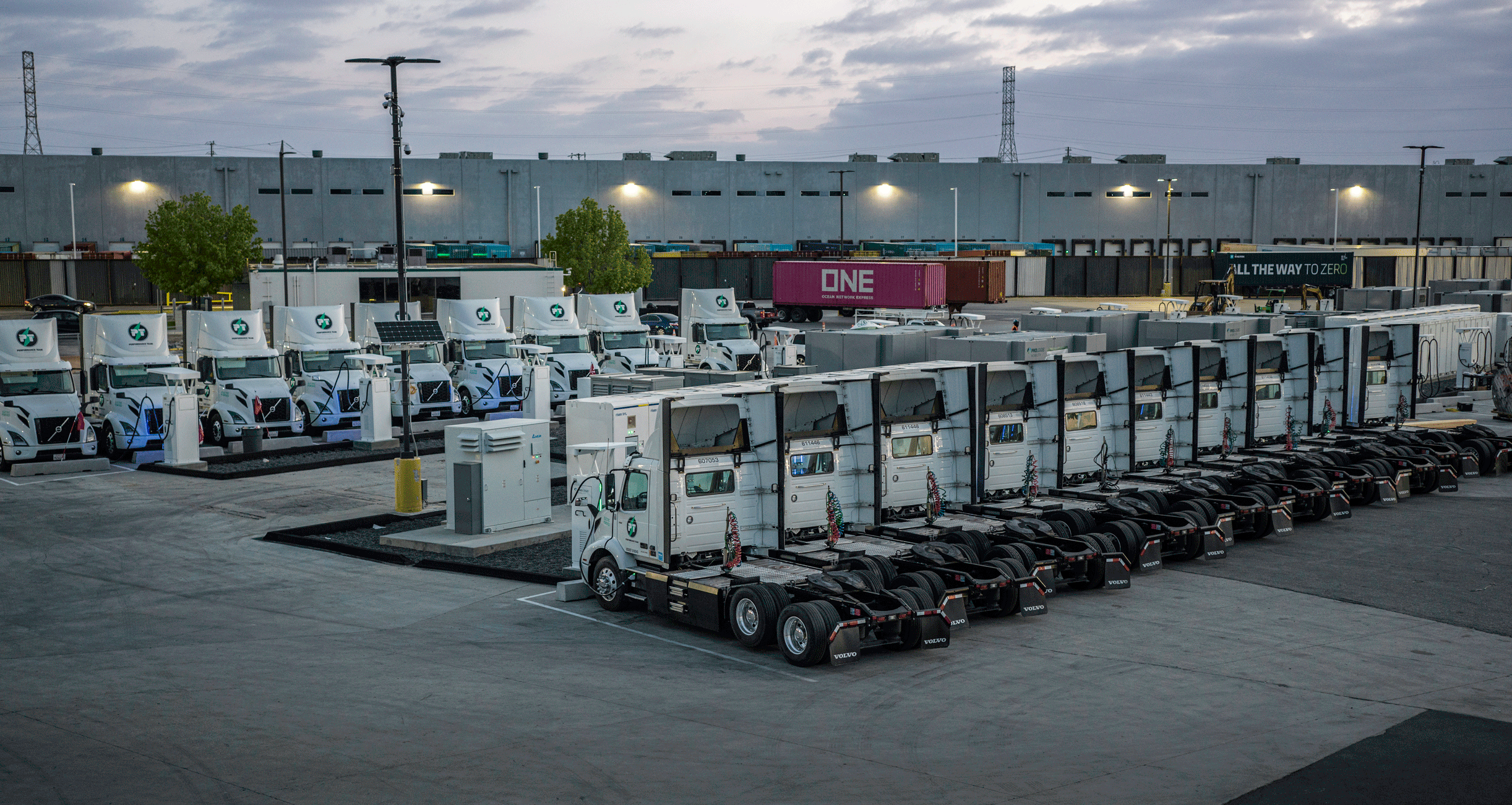 Image of EV trucks lined up charging